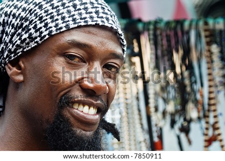 portrait of young rasta man in the craft market