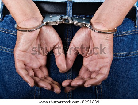 stock photo Man handcuffed hands at the back Save to a lightbox 