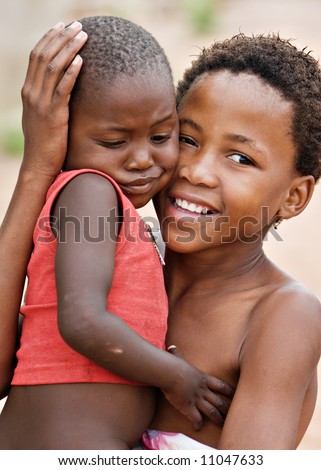 African children brother and sister, social issues, poverty, village near Kalahari desert