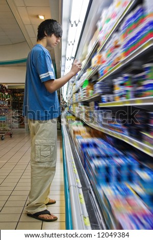 Young Caucasian man shopping in a supermarket