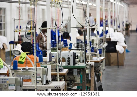 Industrial size textile factory in Africa, African workers on the production line