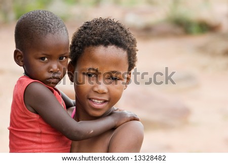 African brother and sister deprived children in a village near Kalahari Desert