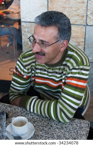 Iranian Arabic man, having a rest at a coffee shop