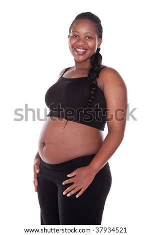 stock photo young pregnant African woman with black top and long braids