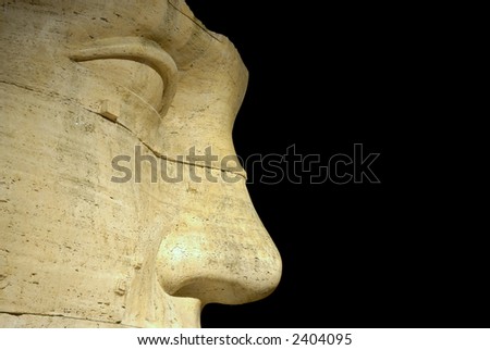 Detail of man face statue isolated on black - Rome, Italy