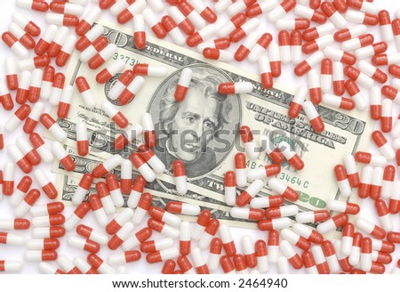 20 dollars bills covered by red and white pills