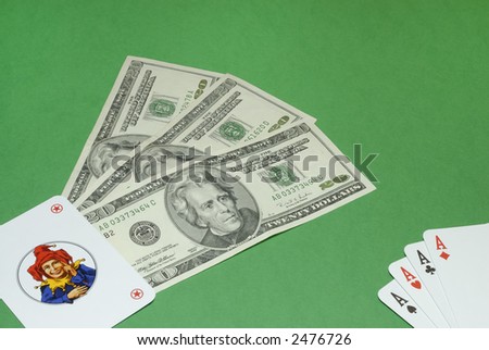 Poker with jolly and dollar bills on a casino table background