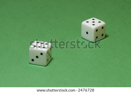 Gambling dices on a casino table background