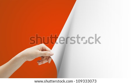 women hand turns red page on white background