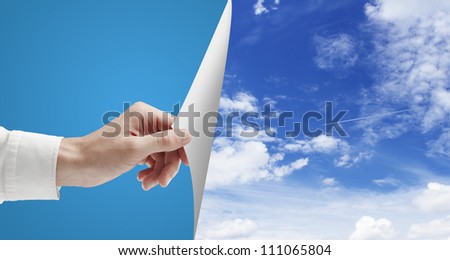 hand turn page to blue sky