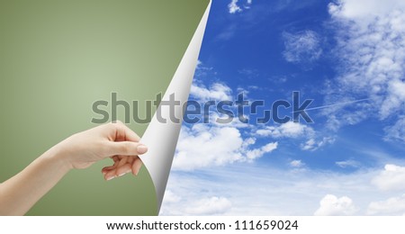 hand turn page to blue sky