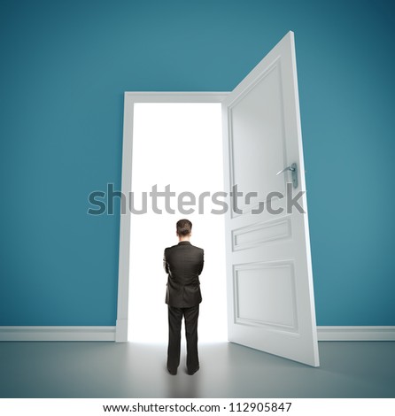 businessman in blue room with doors open