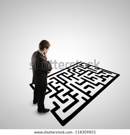 pensive man and  labyrinth on white background
