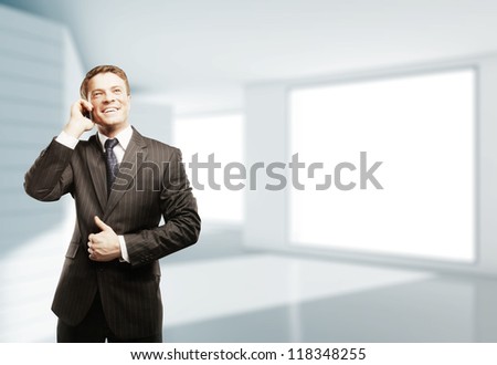 businessman with phone  in white room