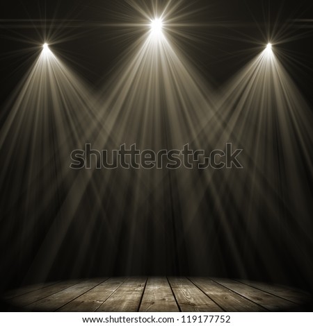 Three Stage Spot Lighting Over Dark Background