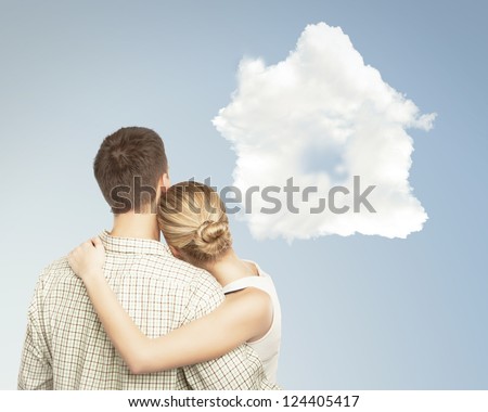 young couple and white cloud house