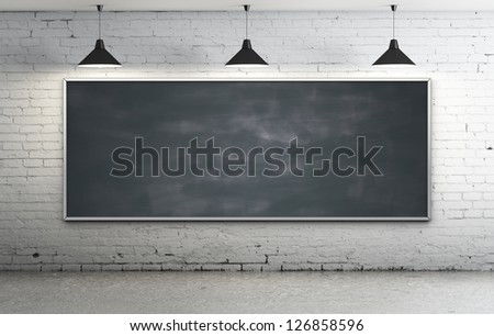 Black blackboard in brick loft