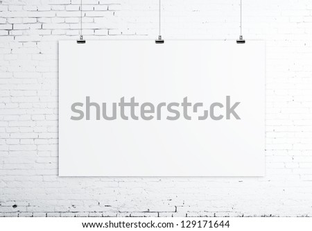 white poster on brick wall