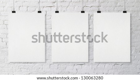 brick wall with three blank poster brick wall with three blank poster