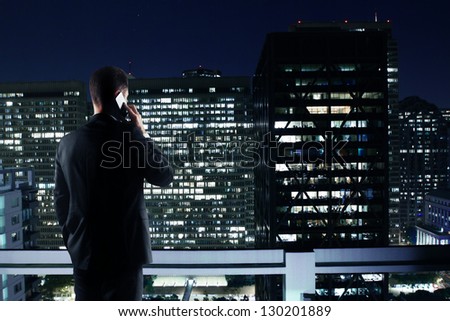Man With Phone Looking To Night City