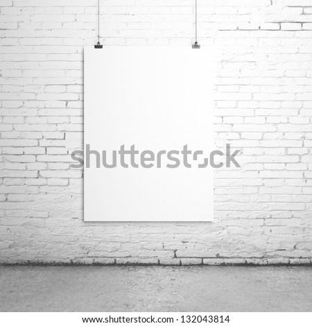 white blank paper clips on brick room