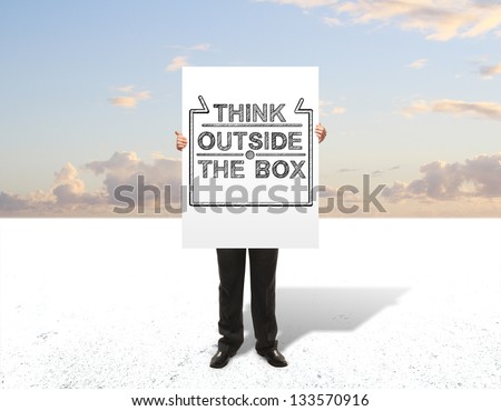 businessman holding  poster think outside the box