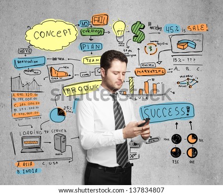 businessman holding phone and drawing  business concept on wall