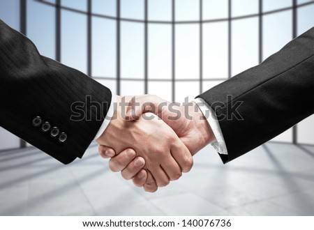 business handshake in office