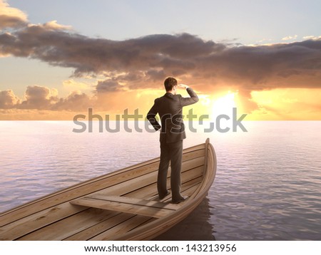 man standing on a boat and looking on sunrise