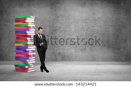 businessman with phone and books