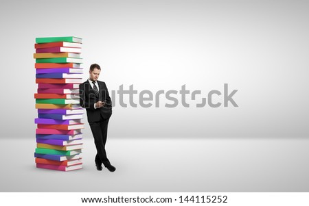 businessman with phone and books in room