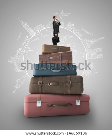 businessman and stack of books, travel concept