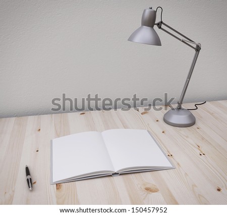 opened book and pen on the table with lamp