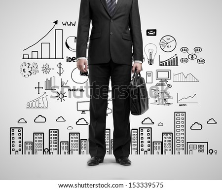 businessman standing with briefcase and drawing business concept