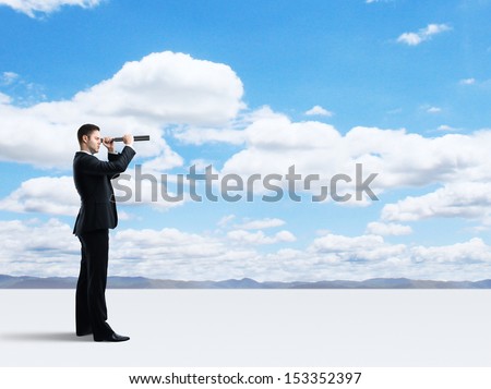 businessman looking through a telescope