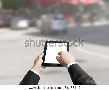 hands holding a touch pad