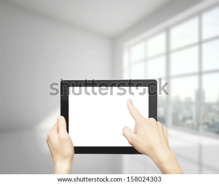 hand holding and pushing touch pad in office