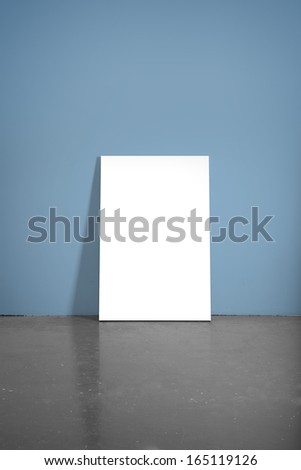 realistic concrete floor and blue wall with poster