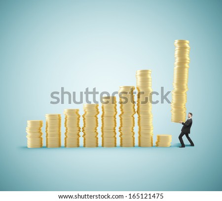 businessman with tower of coins with coins
