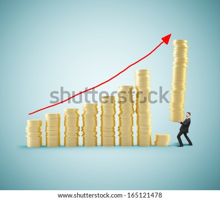 businessman with tower of coins building chart coins