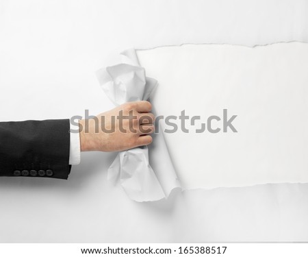 Hand Tears Page On White Background