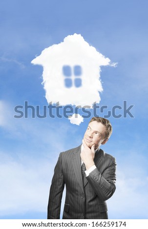young businessman dreaming  of a new house