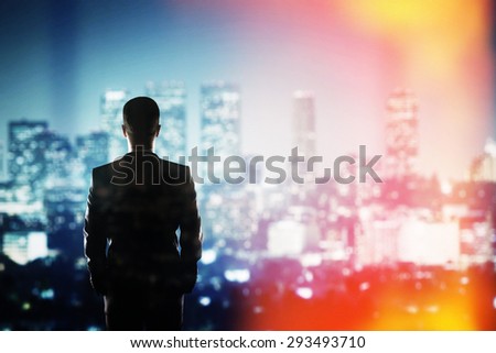 businessman thinking and looking to night city