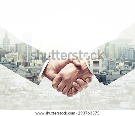 handshake on a city background, double exposure