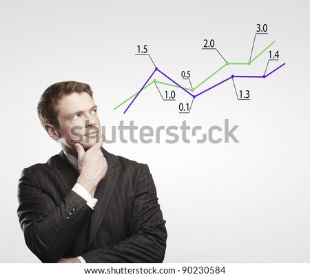 Young business man look at a graph. Rising arrow, representing business growth. On a gray background