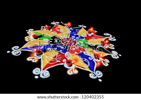 Rangoli, hand sketched patterns and designs filled colored powder are a common item in hindu homes at divali and new year usually accompanied by ghee (butter) burning candles called diva