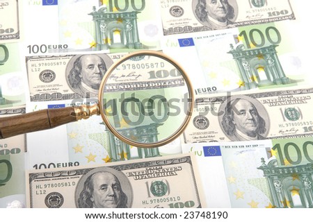object on white - currency magnifying glass with money