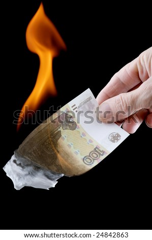 object on black - currency  burning paper money