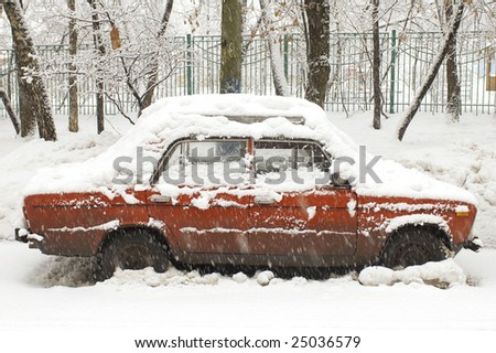 winter car during a snowfall in town