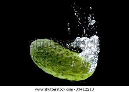 object on black - food Cucumber in water